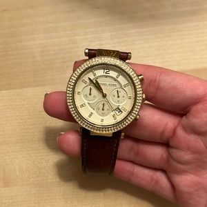 Leather band and gold face with Diamond ring